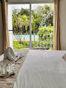 Ένα ή περισσότερα κρεβάτια σε δωμάτιο στο Villas Cozumel con alberca