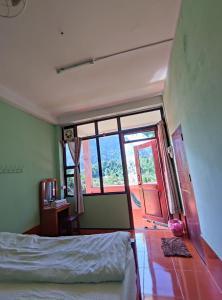 Ένα ή περισσότερα κρεβάτια σε δωμάτιο στο Veranda guesthouse and Bungalows