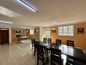 a dining room with a table and chairs at IL Ladrone in Ruiru