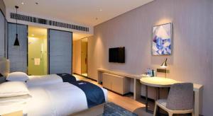 Postel nebo postele na pokoji v ubytování Echarm Hotel Xian Ming City Wall South Gate