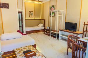 Ένα ή περισσότερα κρεβάτια σε δωμάτιο στο Family Hotel Gradia 1 +17 φωτογραφίες