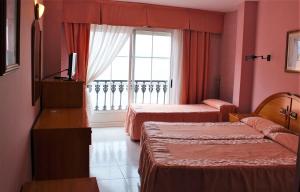 Posteľ alebo postele v izbe v ubytovaní Hotel Paraíso Del Marisco