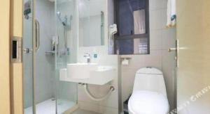a bathroom with a toilet and a sink and a shower at City Comfort Inn Changsha Window of the World Zhongmao City in Changsha +83 photos