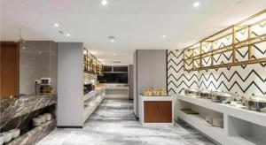 Kuchyň nebo kuchyňský kout v ubytování Borrman Hotel Guigang Pingnan Donghu