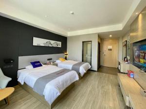 Postel nebo postele na pokoji v ubytování Jun Hotel Hunan Yongzhou Ningyaun Shundi Plaza + 151 fotografií