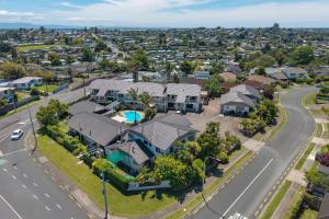 an aerial view of a house in a suburb at Summit Motor Lodge in Tauranga