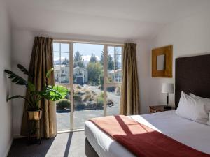 Ένα ή περισσότερα κρεβάτια σε δωμάτιο στο Mantra Lake Tekapo +110 φωτογραφίες