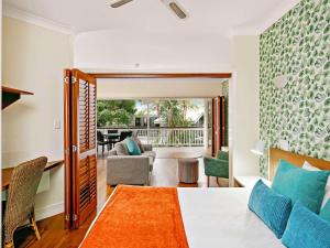 a bedroom with a bed and a living room at Mantra on the Inlet in Port Douglas +55 photos