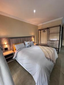 Ένα ή περισσότερα κρεβάτια σε δωμάτιο στο Fourteen38 Mews Guesthouse