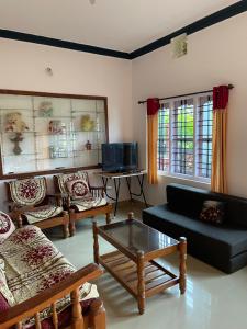 Χώρος καθιστικού στο Coorg Mists Homestays