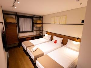 Ένα ή περισσότερα κρεβάτια σε δωμάτιο στο Ibis Votuporanga +57 φωτογραφίες