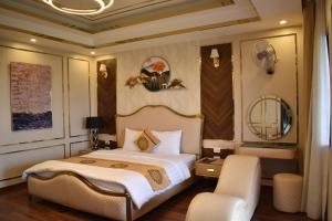 Postel nebo postele na pokoji v ubytování Sunglow Hotel