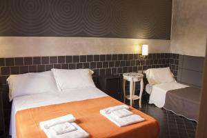 Postel nebo postele na pokoji v ubytování Hotel Agorà