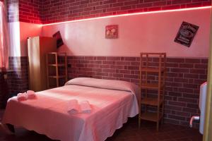 Postel nebo postele na pokoji v ubytování Hotel Agorà