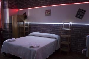 Postel nebo postele na pokoji v ubytování Hotel Agorà