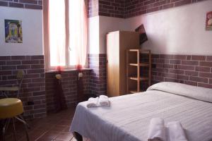 Postel nebo postele na pokoji v ubytování Hotel Agorà