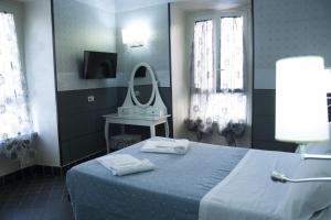 Postel nebo postele na pokoji v ubytování Hotel Agorà