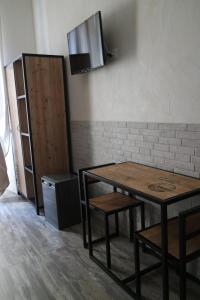 TV a/nebo společenská místnost v ubytování Hotel Agorà