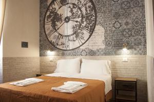 Tempat tidur dalam kamar di Hotel Agorà
