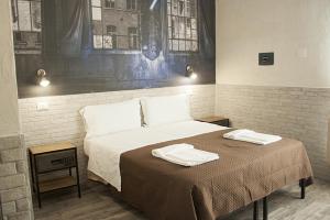 Postel nebo postele na pokoji v ubytování Hotel Agorà
