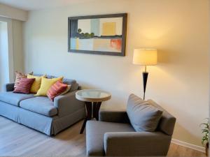 a living room with a couch and a chair at Premier Resort Style Living Minutes from Santa Monica in Los Angeles
