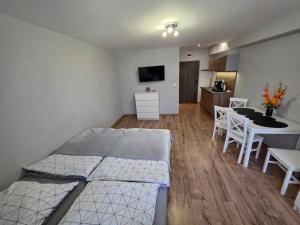 Postel nebo postele na pokoji v ubytování ApartHotel10