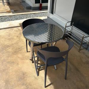 two chairs and a table and a table and chairs at Orchid Cabin Kuala Tahan in Kuala Tahan +7 photos