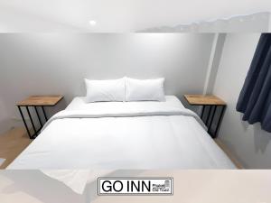 Ένα ή περισσότερα κρεβάτια σε δωμάτιο στο XXNEW GO INN Phuket City - โกอินน์ ภูเก็ต โอลทาวน์ Old Town