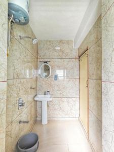 a bathroom with a sink and a shower at Serenity Nest in Lava