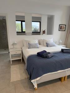 a bedroom with two large beds in a room at Trebol in Sa Pobla