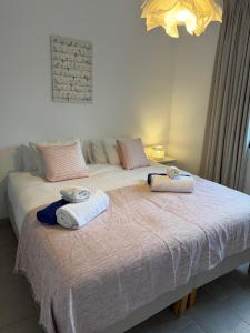 a bedroom with two beds with towels on them at Trebol in Sa Pobla +15 photos