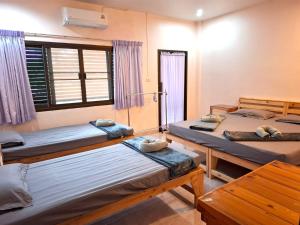 Ένα ή περισσότερα κρεβάτια σε δωμάτιο στο Padang Besar In front of Border Private room & Hostel