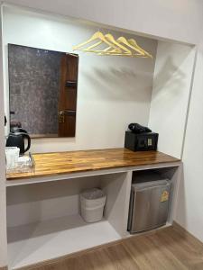 a counter with a mirror in a room at Stay at Lanta Bungalow in Ko Lanta