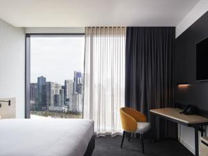 Ένα ή περισσότερα κρεβάτια σε δωμάτιο στο Novotel Melbourne South Wharf +105 φωτογραφίες