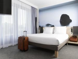 Postel nebo postele na pokoji v ubytování Novotel Charleroi Centre + 70 fotografií