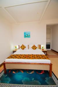 a bedroom with a large bed in a room at Protels La Plage in Bwejuu +55 photos