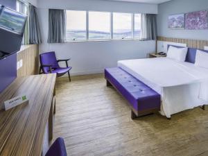 Ένα ή περισσότερα κρεβάτια σε δωμάτιο στο ibis Styles Confins Aeroporto