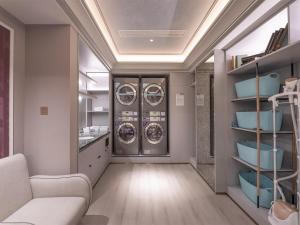 a laundry room with two washer and dryer machines at Mercure Xi'an High-tech Zone Center in Xi'an +74 photos
