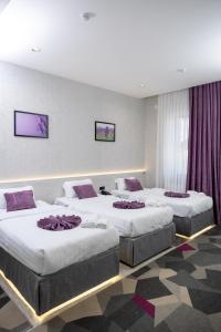 Postel nebo postele na pokoji v ubytování Lavanda hotel Free Airport Service