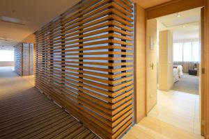 Postel nebo postele na pokoji v ubytování Wyndham Concepcion Pettra