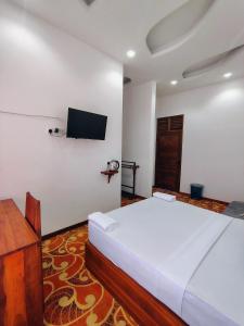 TV a/nebo společenská místnost v ubytování Sinharaja Tea Garden Hotel