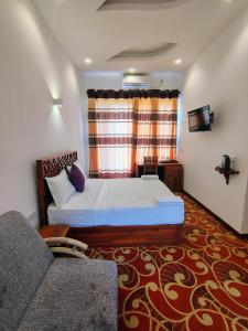 Postel nebo postele na pokoji v ubytování Sinharaja Tea Garden Hotel