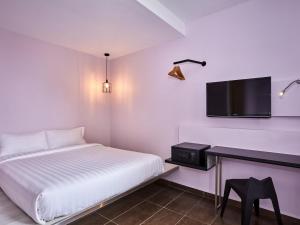 Et tv og/eller underholdning på ibis budget Singapore Pearl