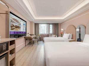 Ένα ή περισσότερα κρεβάτια σε δωμάτιο στο Mercure Beijing Anzhen Olympic Center +52 φωτογραφίες