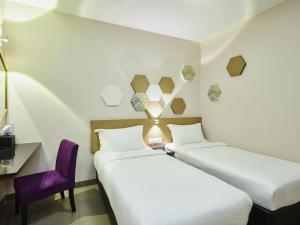 Postel nebo postele na pokoji v ubytování ibis budget Singapore Imperial + 60 fotografií