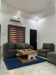 Posezení v ubytování Comfy Abode