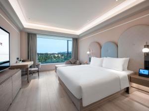 Ένα ή περισσότερα κρεβάτια σε δωμάτιο στο Mercure Guangzhou Baiyun International Airport - Airport Free Shuttle Bus +115 φωτογραφίες