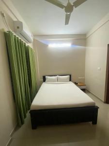 Postel nebo postele na pokoji v ubytování Neurogreen Apartments