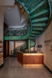 a large room with a large sculpture on the wall at Abode Jaipur in Jaipur