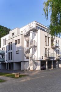a building with a spiral staircase on the side of it at Abbey View Suites in Echternacherbrück +3 photos